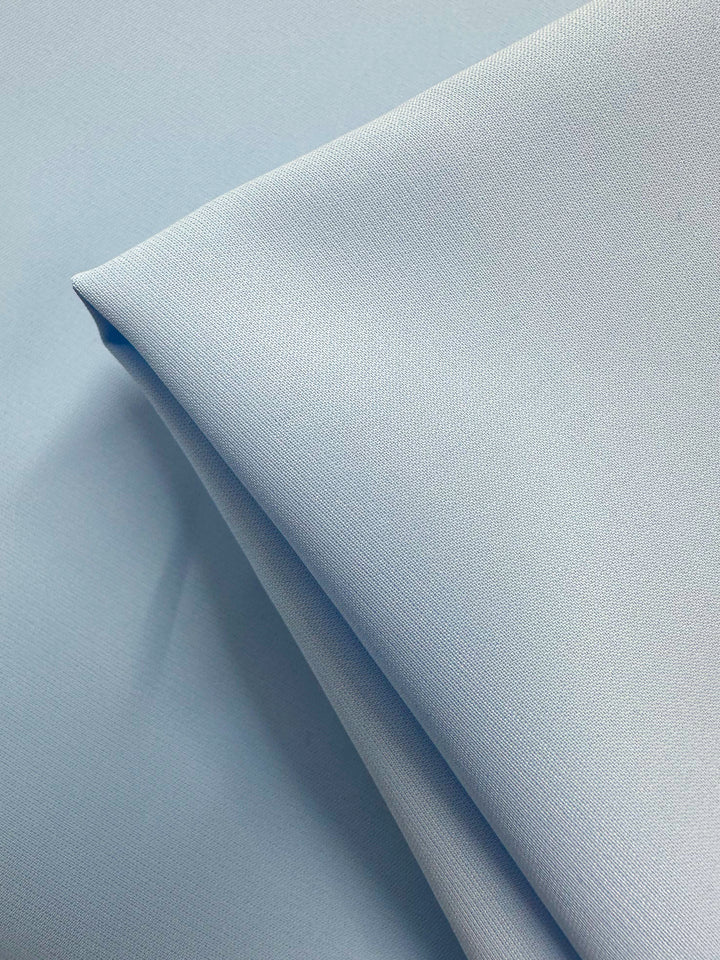 A close-up of Super Cheap Fabrics’ Microfibre Suiting - Nantucket Breeze (150cm): light blue, lightweight polyester with a smooth, tightly woven texture and a clean, minimalistic look.