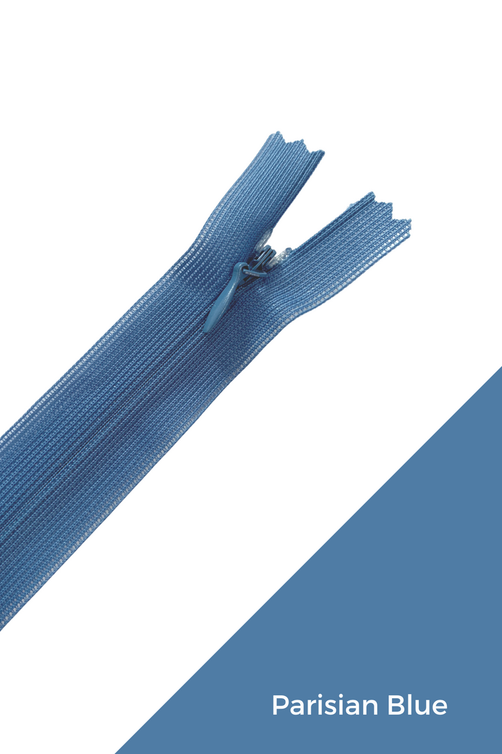 A close-up image of an invisible 30cm blue zipper from Super Cheap Fabrics is set against a white background with a blue diagonal area at the bottom right. The text "Parisian Blue" is displayed in the blue area, highlighting the elegant finish of this 100% polyester fabric.