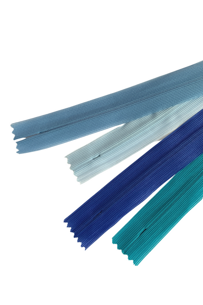 A set of five Invisible Zip - 30cm - Blues from Super Cheap Fabrics in various shades of blue and teal, arranged next to each other on a white background. The zippers are unzipped, revealing their elegant finish and visible teeth.